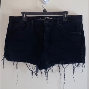 Black distressed high rise shorts.